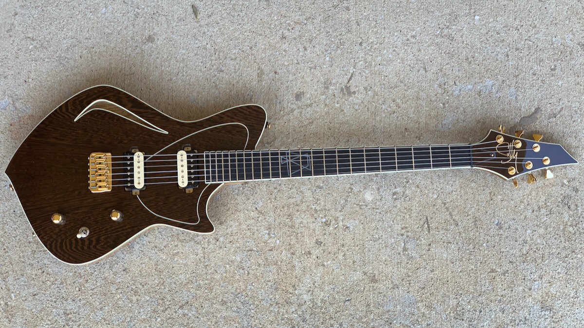 Custom electric guitar on concrete
